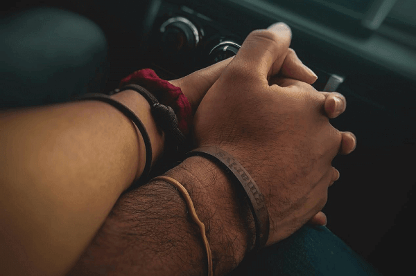 morse code bracelet on couple’s hands